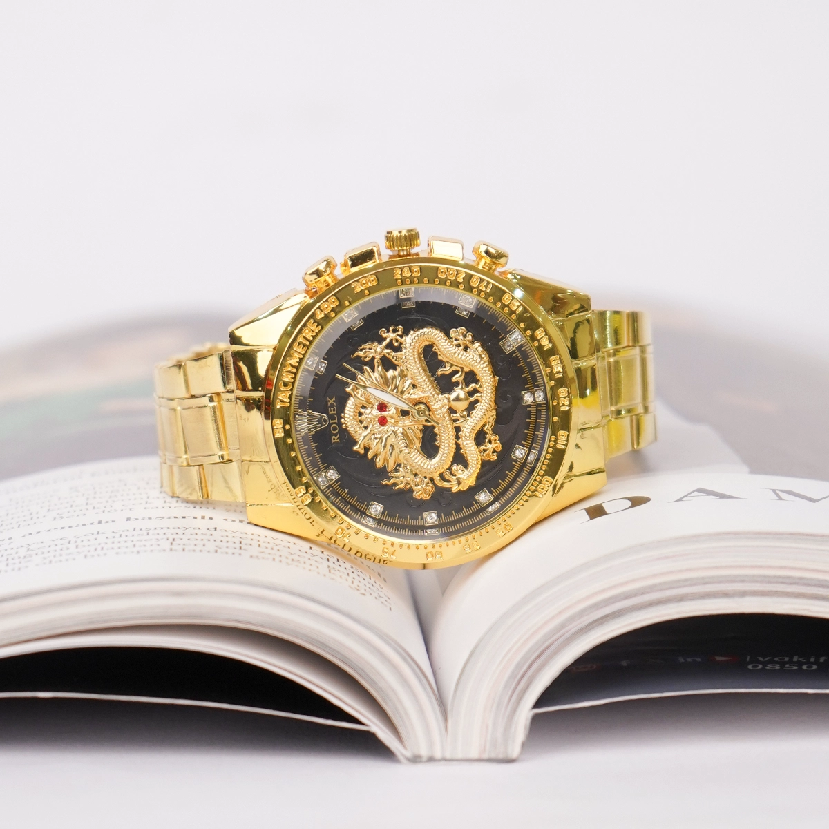 ساعت مردانه طلایی صفحه مشکی مدل DRAGON